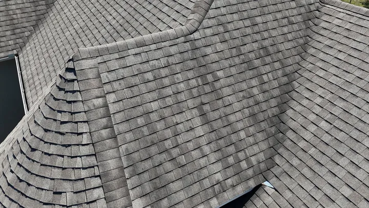 New architectural shingles along a hip and a valley